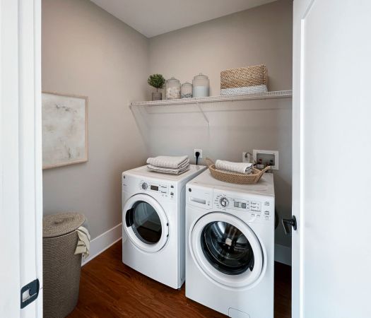 Van Alen Tower apartment laundry room with full size laundry machines