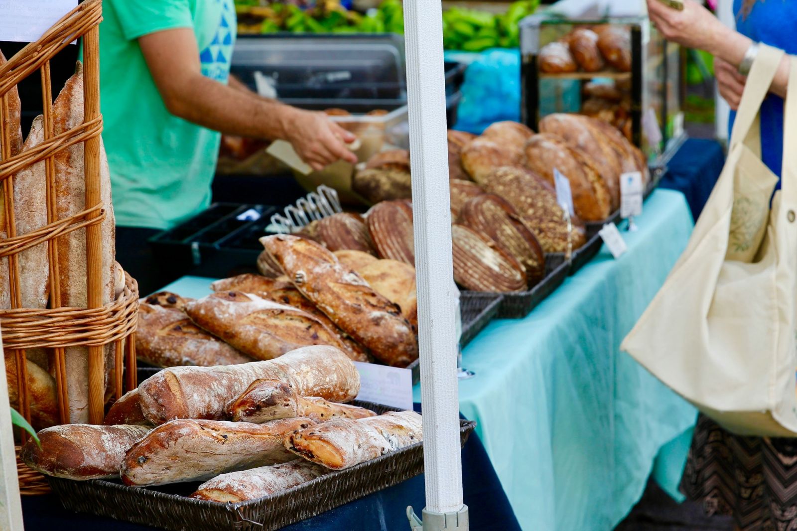People shopping for fresh bread at a farmers market
