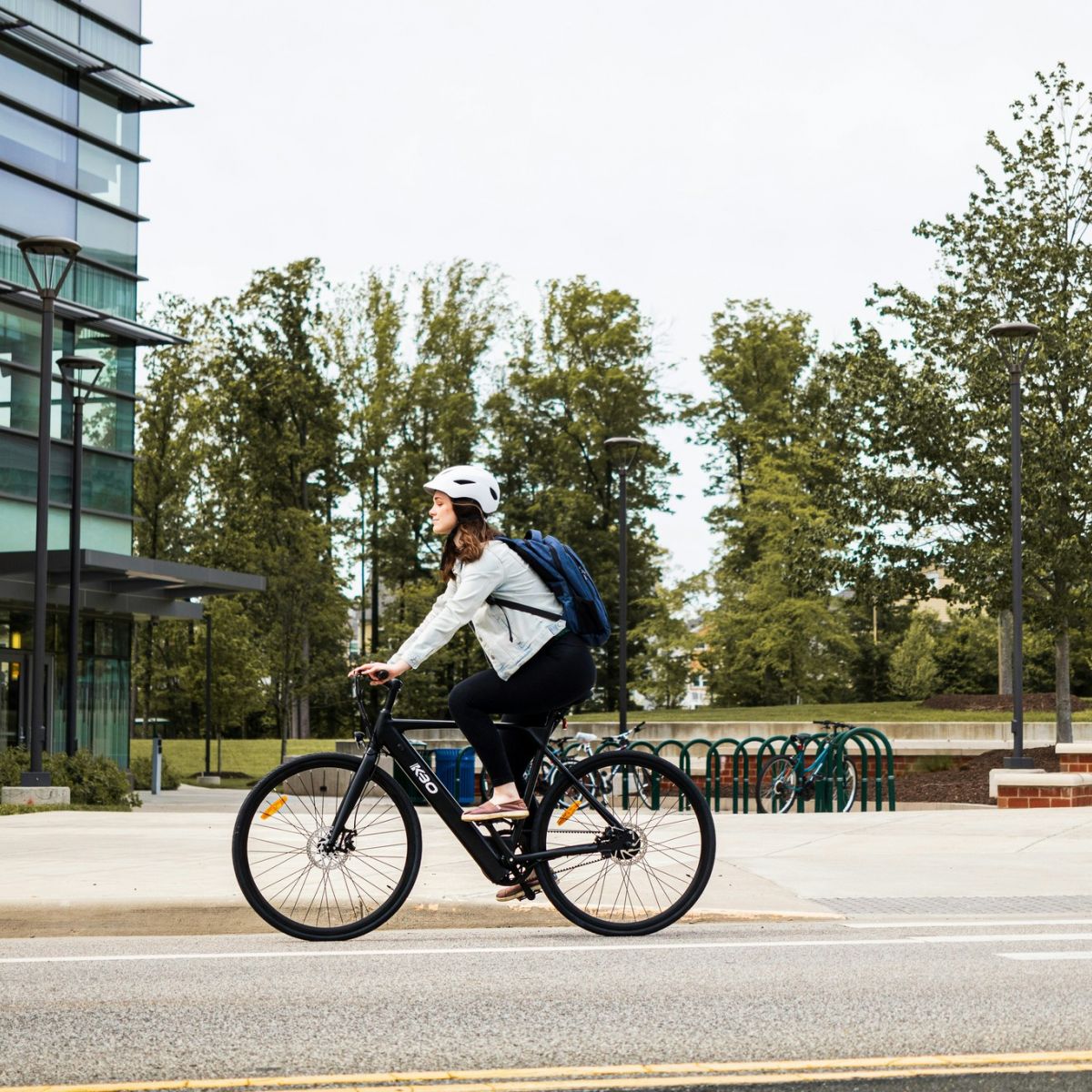 Person commuting on a bike in business attire