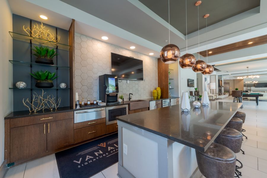 Van Alen apartments resident community lounge with modern kitchen and wet bar