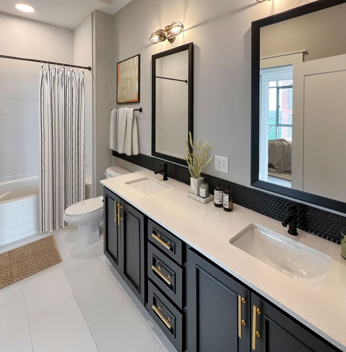 Providence Row apartment kitchen with island, stainless steel appliances, and beautiful finishes