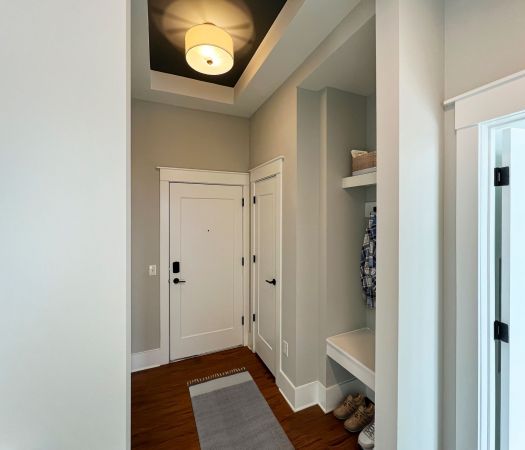 Van Alen Tower apartment entry way with designer tray ceiling and storage nook