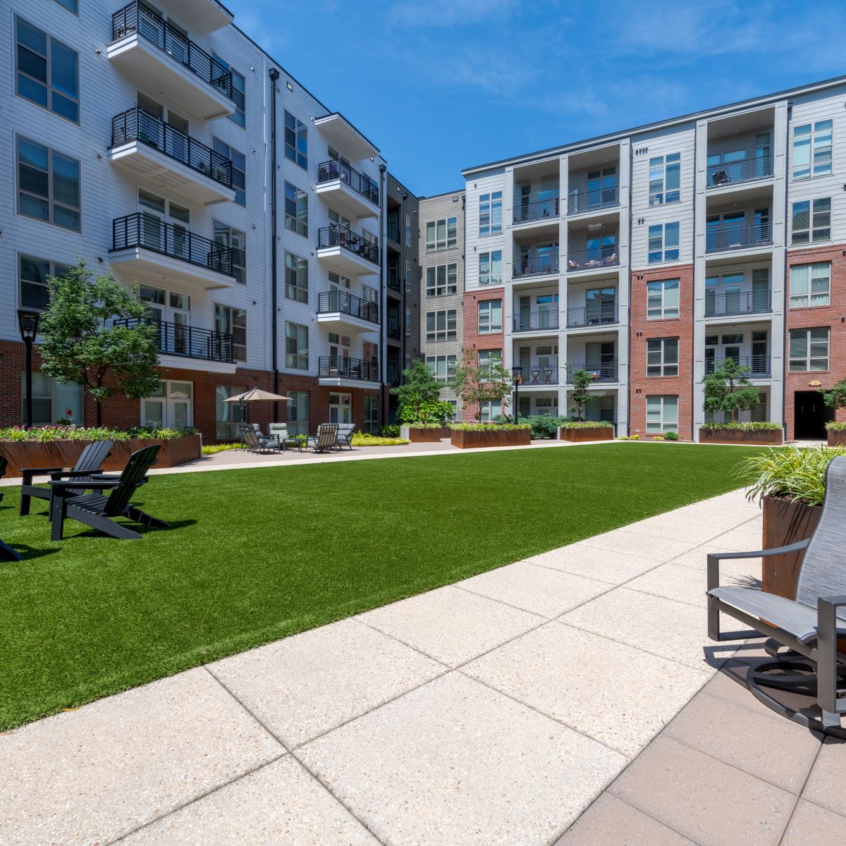 Van Alen apartments resident amenity fitness studio with Peloton bikes and yoga space