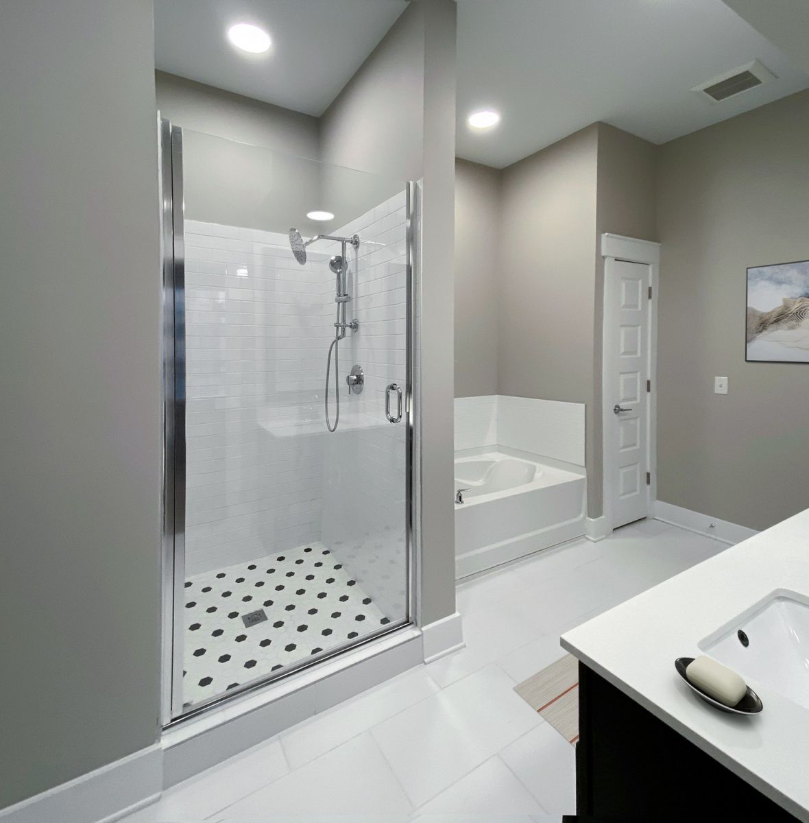 Providence Row apartment kitchen with island, stainless steel appliances, and beautiful finishes