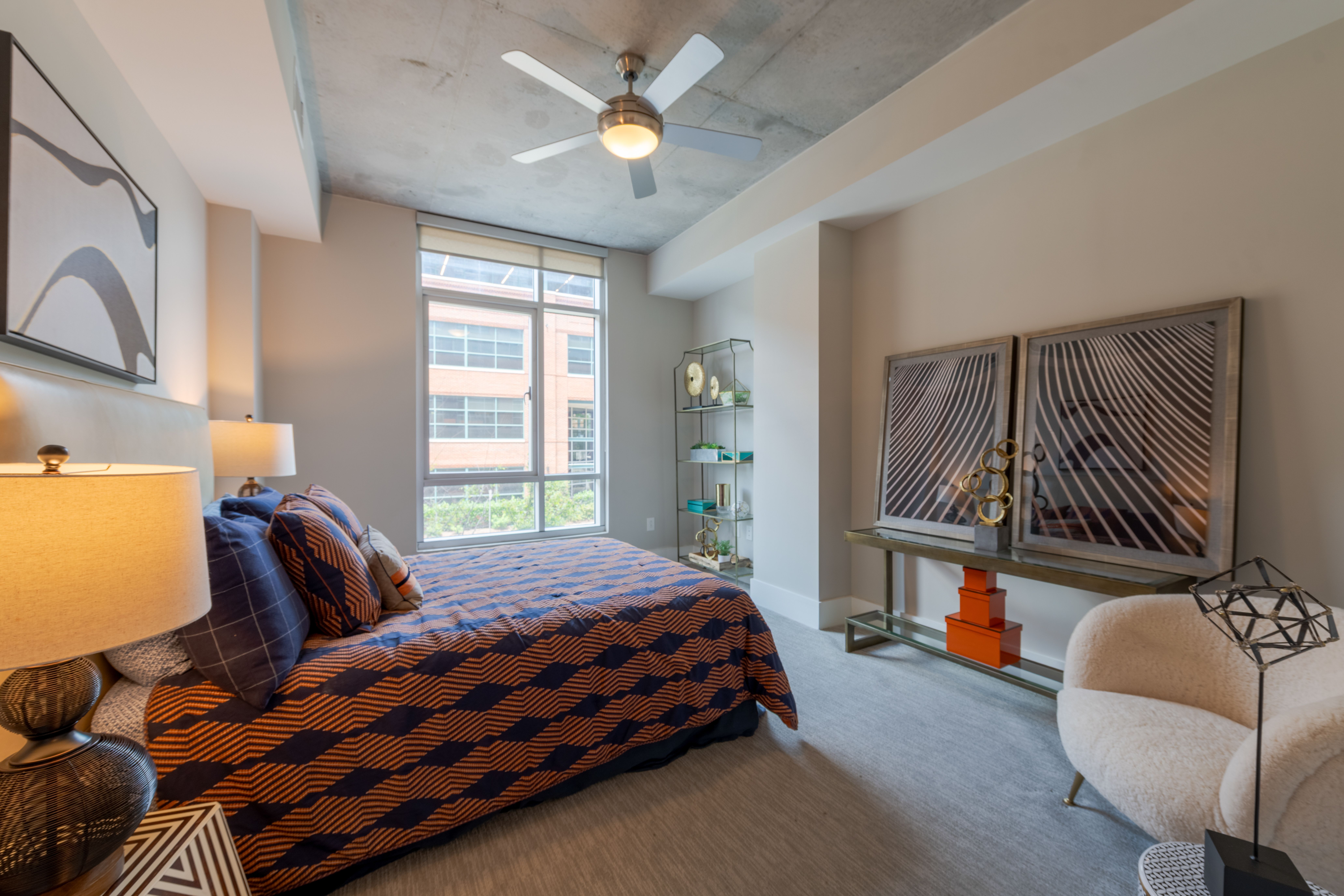 Van Alen apartments in Downtown Durham NC kitchen with custom cabinets and sliding barn door to living room