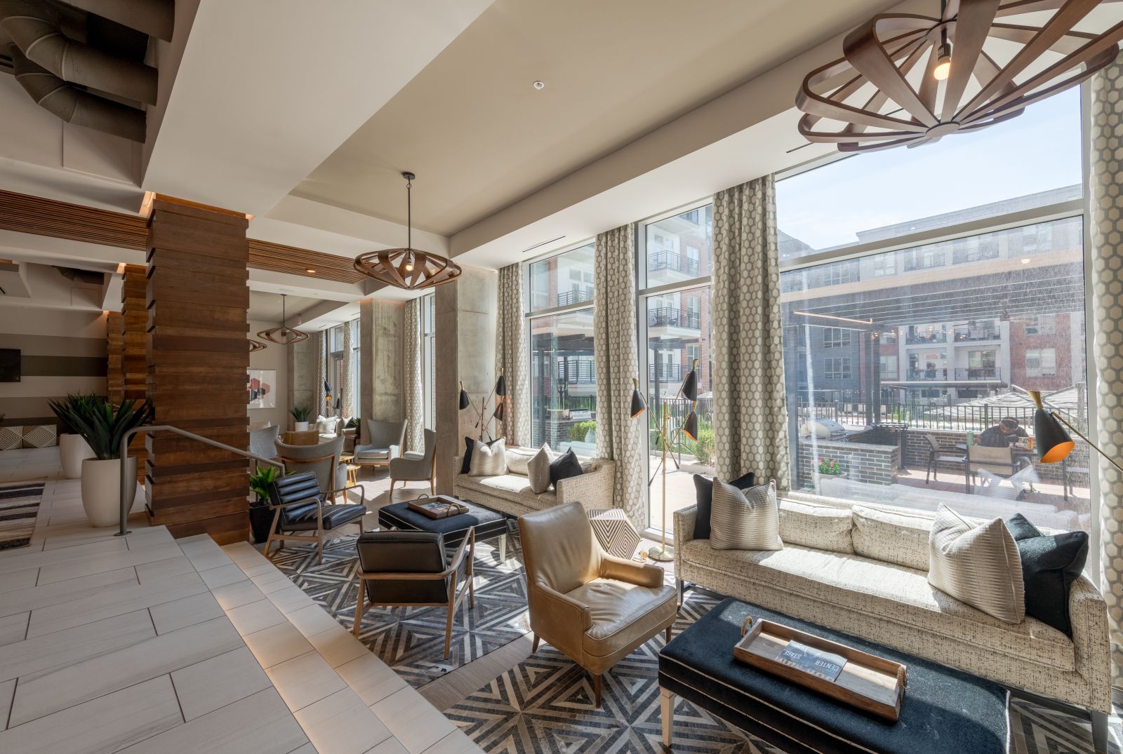 Van Alen community clubhouse with comfortable modern seating and indoor fireplace