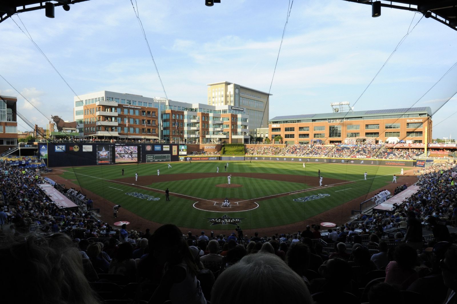 Durham Bulls Athletic Park baseball field with players during a game, Durham NC