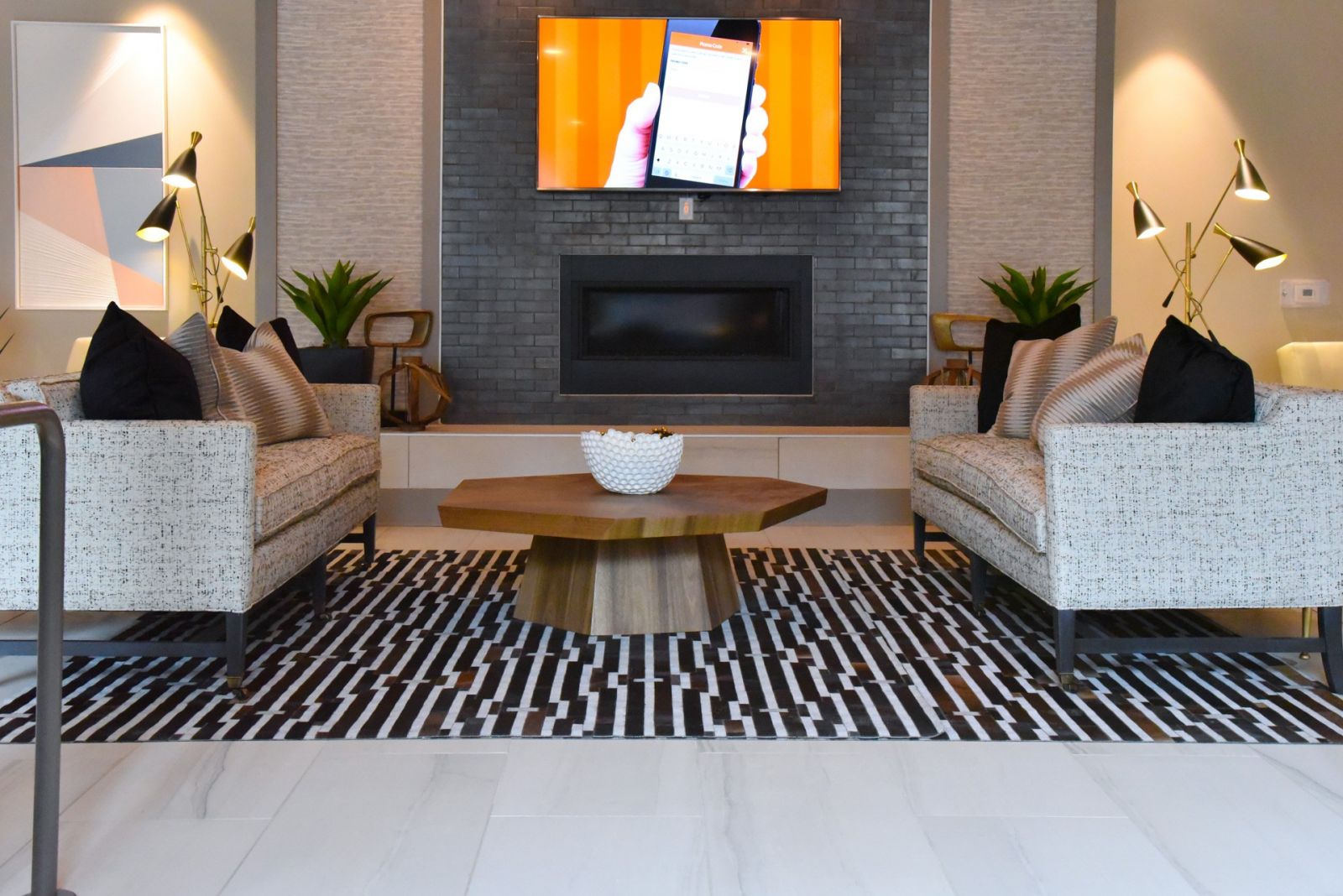 Van Alen community clubhouse with comfortable modern seating and indoor fireplace