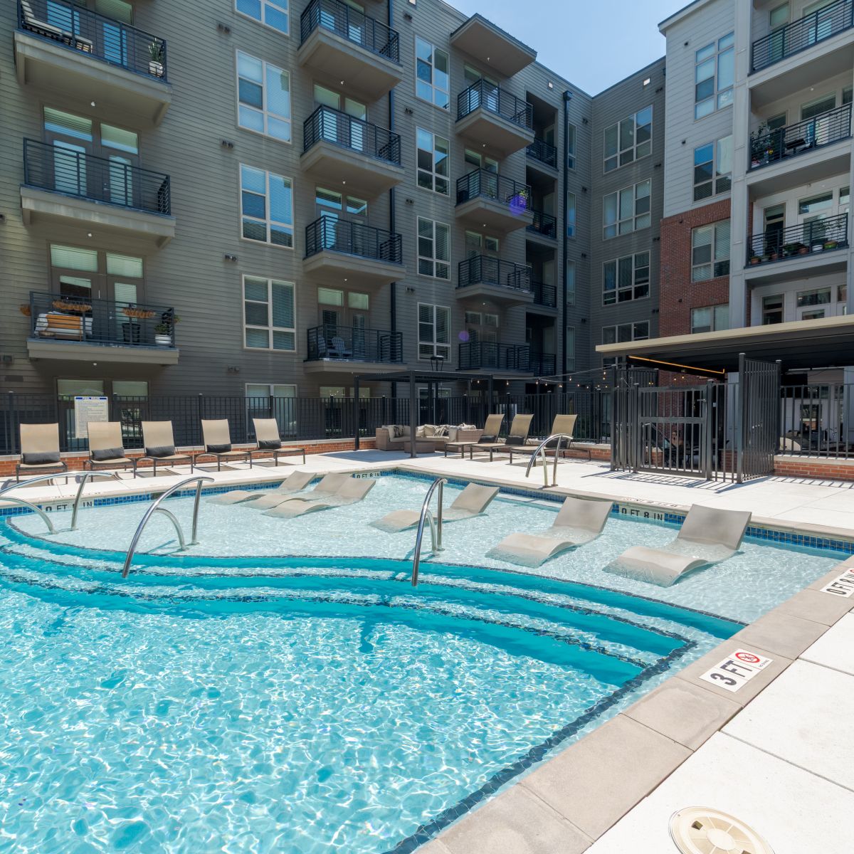 Van Alen apartments resort-inspired pool with in-pool lounge seating