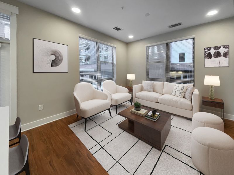 Van Alen Plaza apartment living room with recessed lighting and modern furnishings