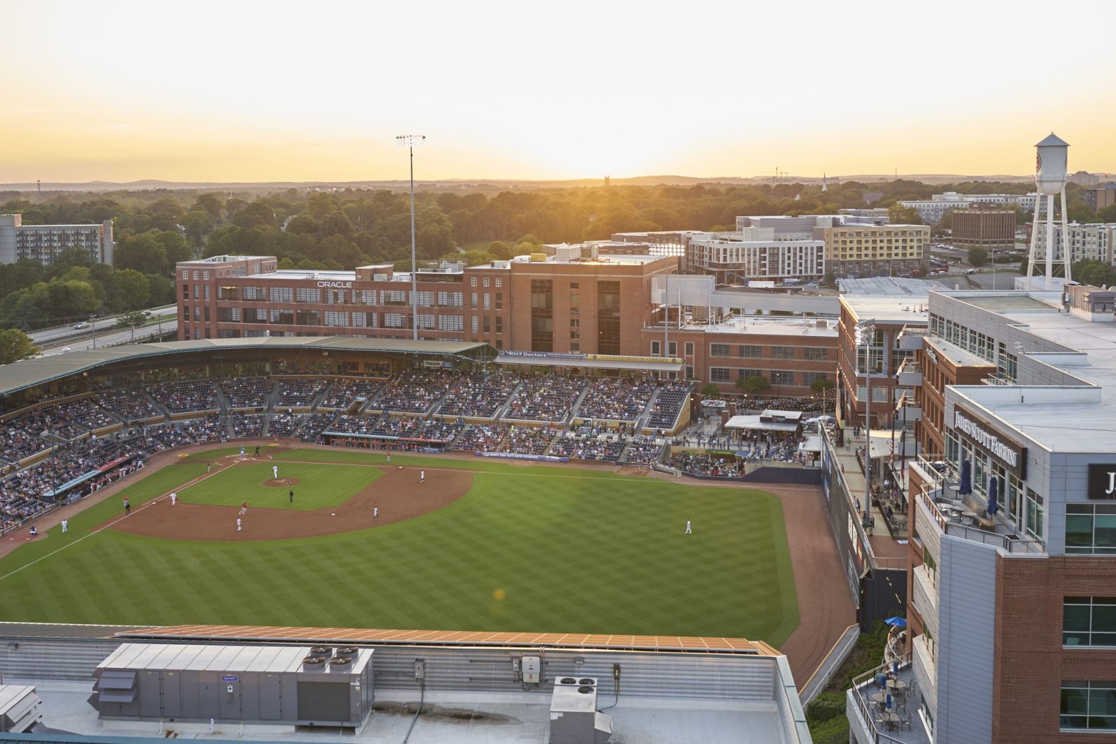 Van Alen community rooftop overlooking city and baseball field