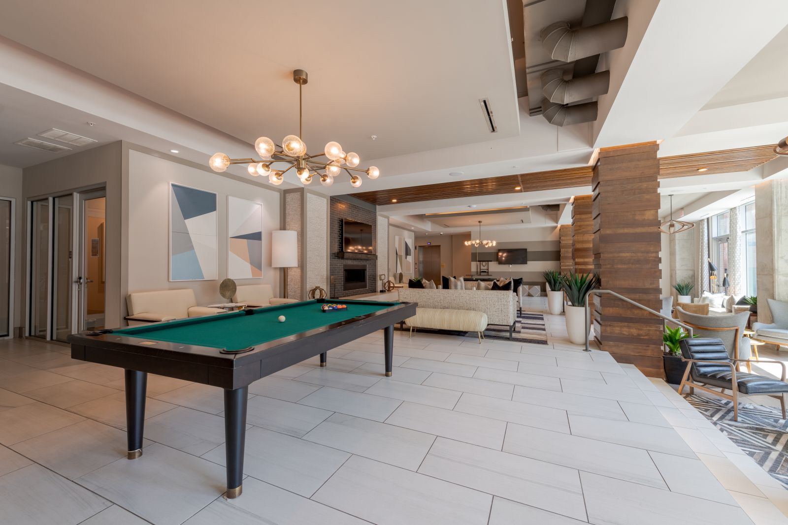 Van Alen apartments resident community lounge with billiards tables and courtyard views