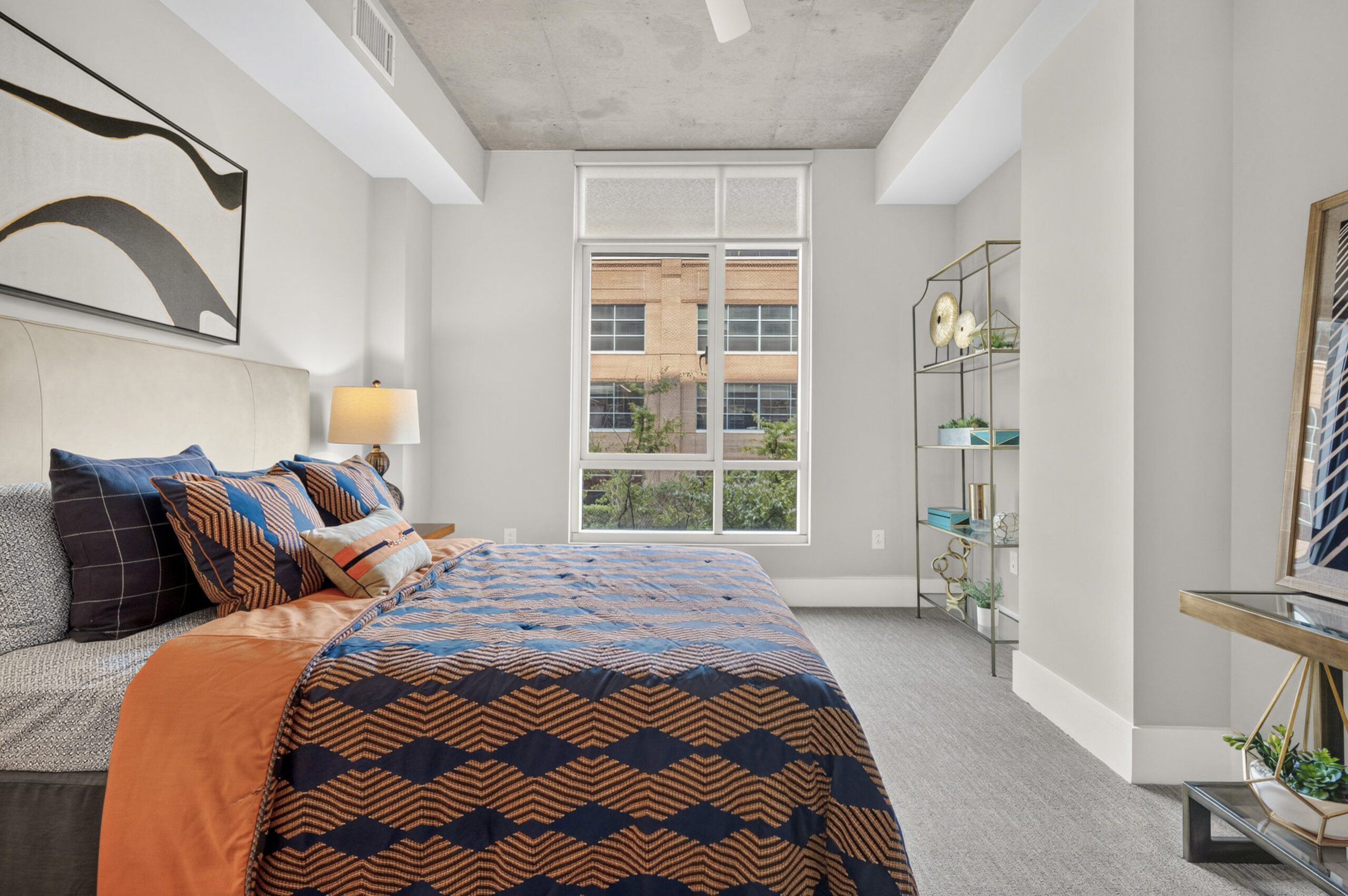 Van Alen apartments in Downtown Durham NC kitchen with custom cabinets and sliding barn door to living room