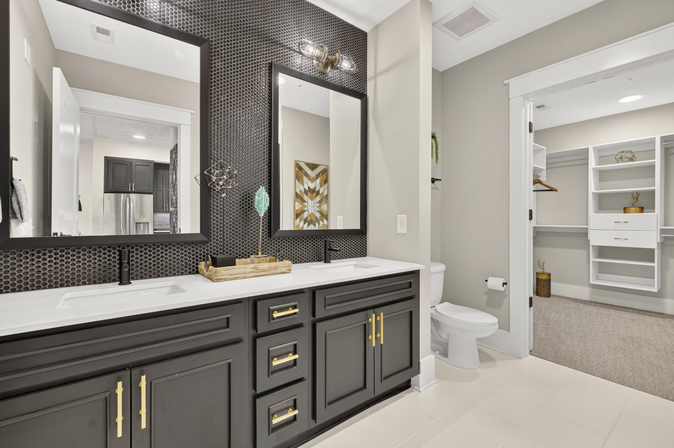 Van Alen apartments in Downtown Durham NC luxury bathroom with custom designer tile and gold fixtures