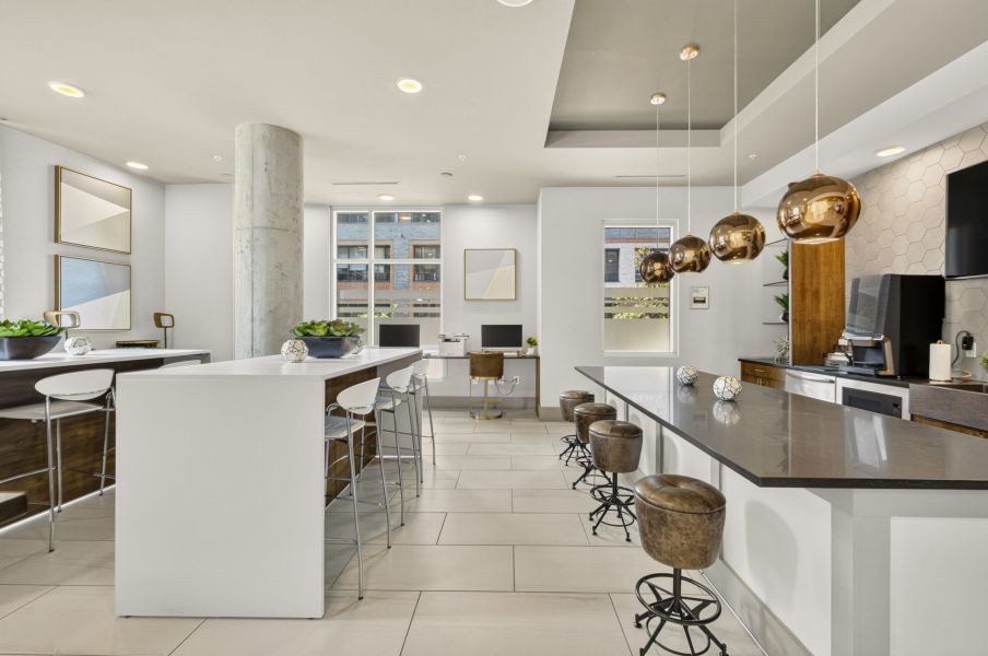 Van Alen apartments resident community lounge with modern kitchen and wet bar