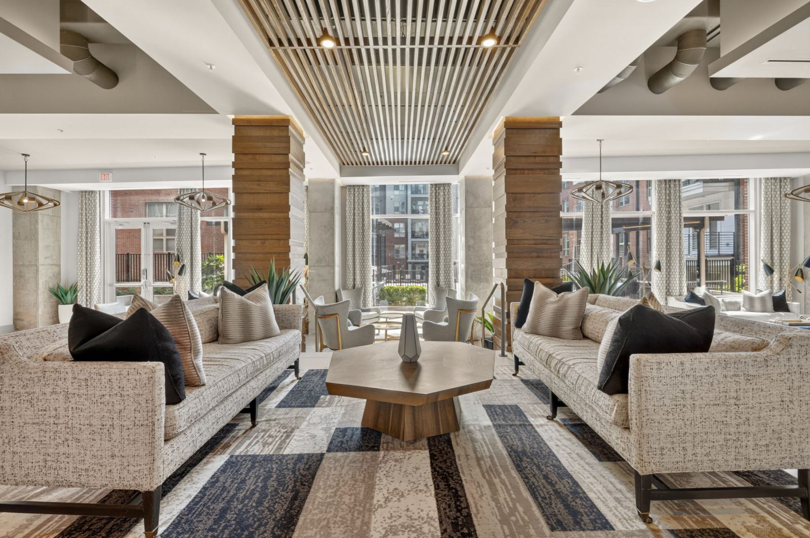 Van Alen community clubhouse with comfortable modern seating and indoor fireplace