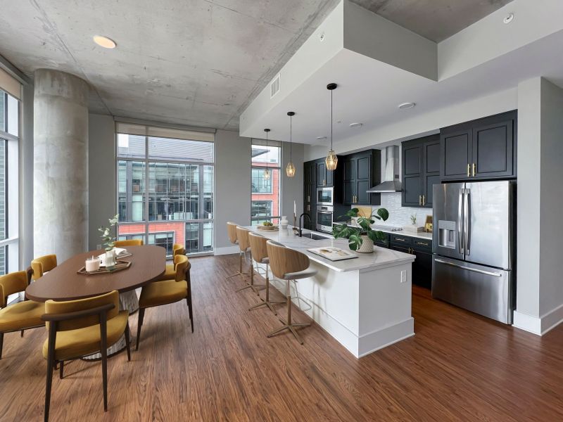 Van Alen apartments in Downtown Durham NC penthouse kitchen and dining area with extra large island and panoramic views