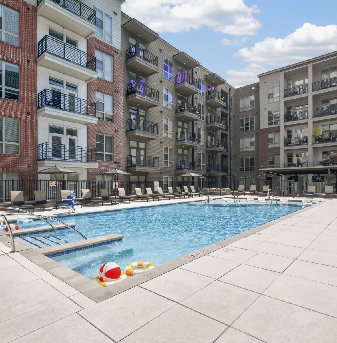 Providence Row apartment kitchen with island, stainless steel appliances, and beautiful finishes