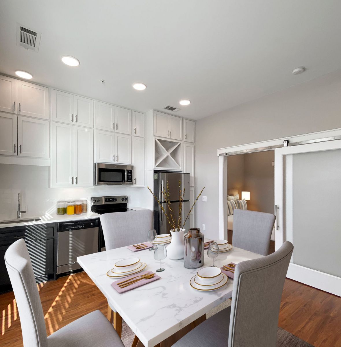 Providence Row apartment kitchen with island, stainless steel appliances, and beautiful finishes