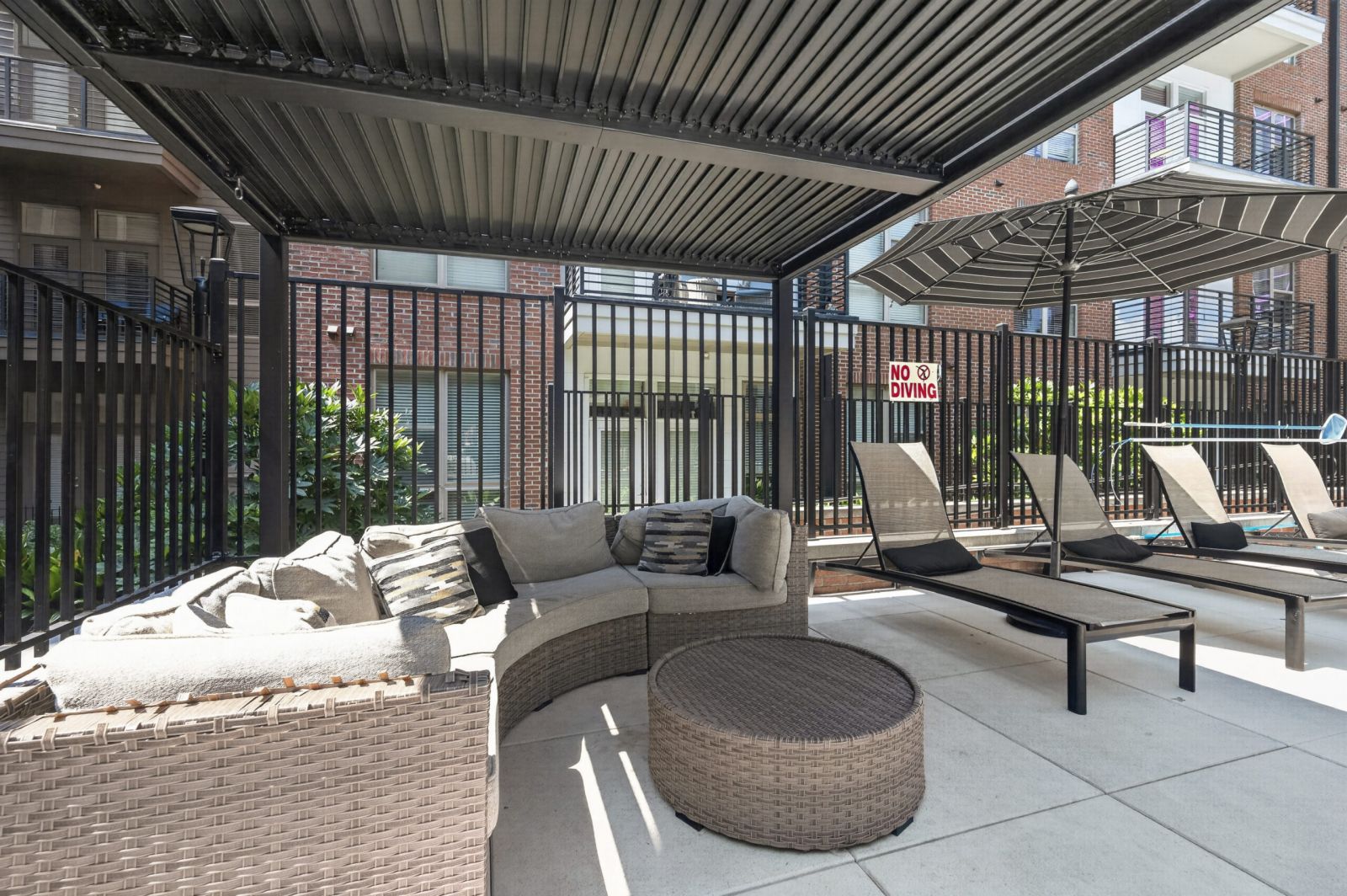Van Alen community outdoor kitchen pavilion with seating and tv